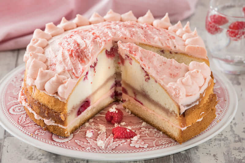 Raspberry Pink GinJam Cake, soft genoise sponge with fresh raspberries and gin-laced raspberry jam.