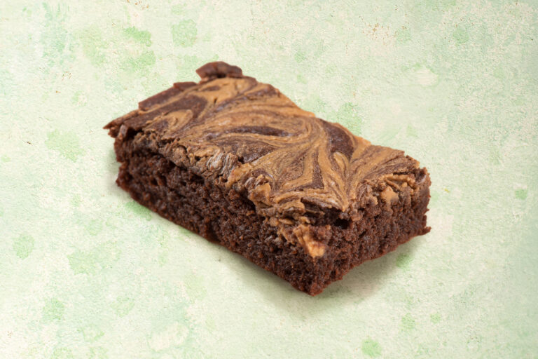 Vegan chocolate peanut brownies with chocolate topping.