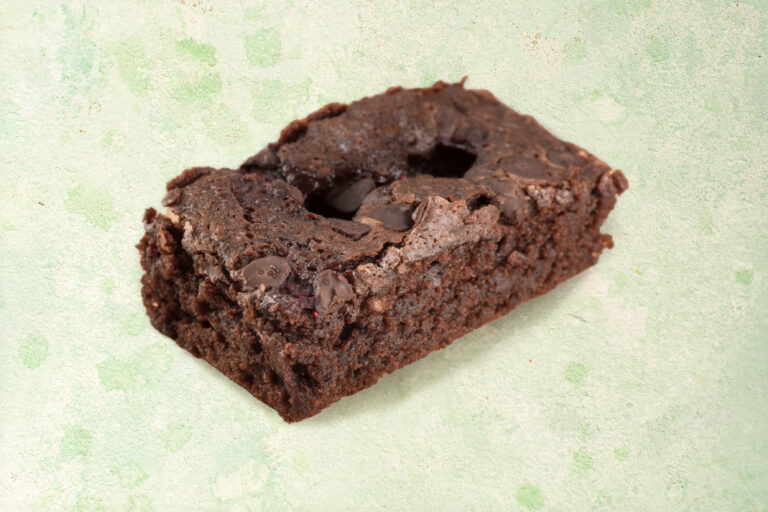 Vegan chocolate raspberry brownies with raspberry topping.