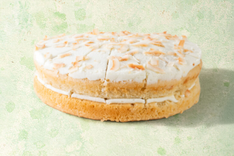 Vegan lime and coconut cake with coconut topping.